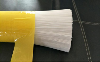 Plastic brush filament